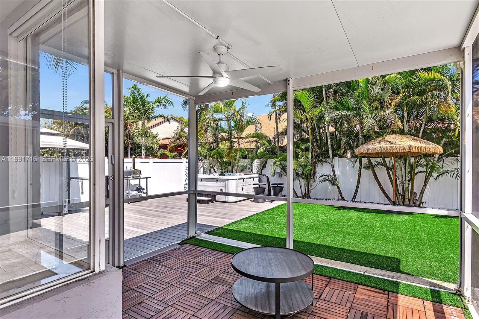 3085 North 36th Avenue Hollywood, FL 33021 - Photo 49 of 76 a view of a porch with furniture and a yard