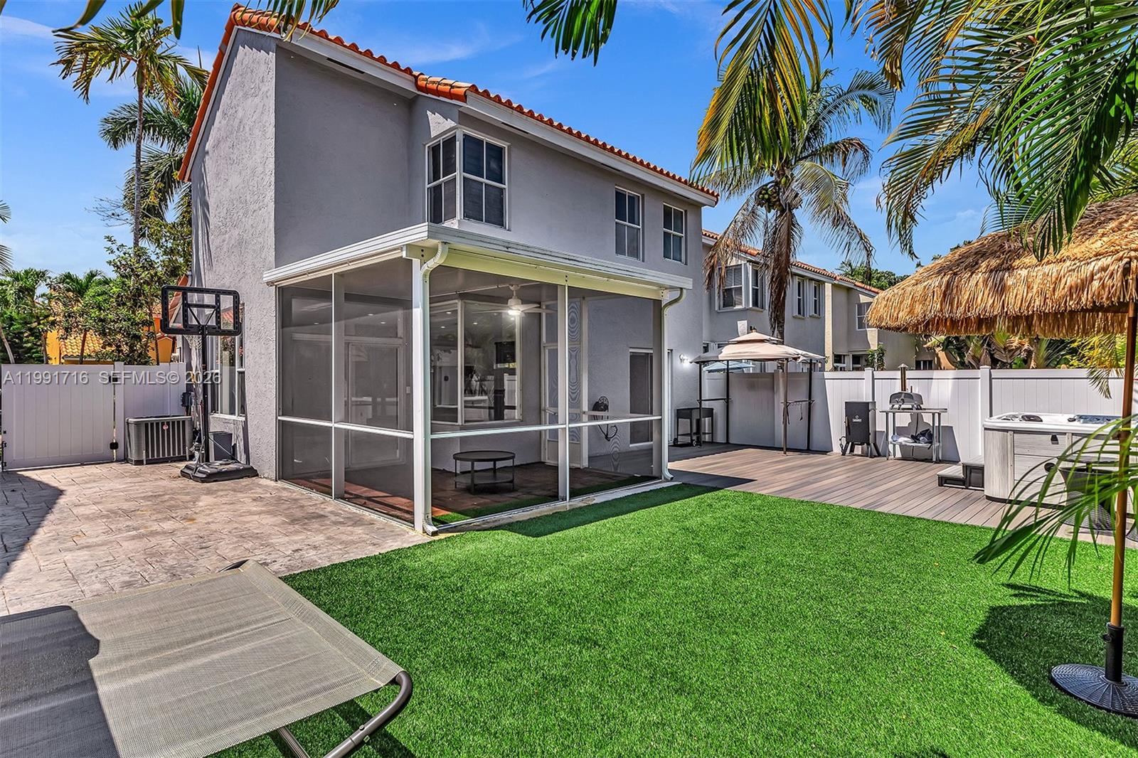 3085 North 36th Avenue Hollywood, FL 33021 - Photo 62 of 76 a view of a house with a yard and furniture