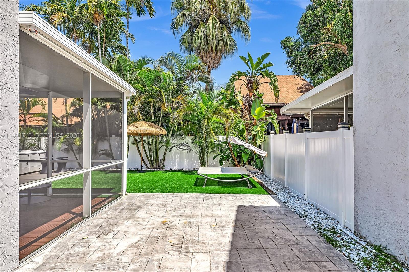 3085 North 36th Avenue Hollywood, FL 33021 - Photo 65 of 76 a front view of a house with a yard and potted plants