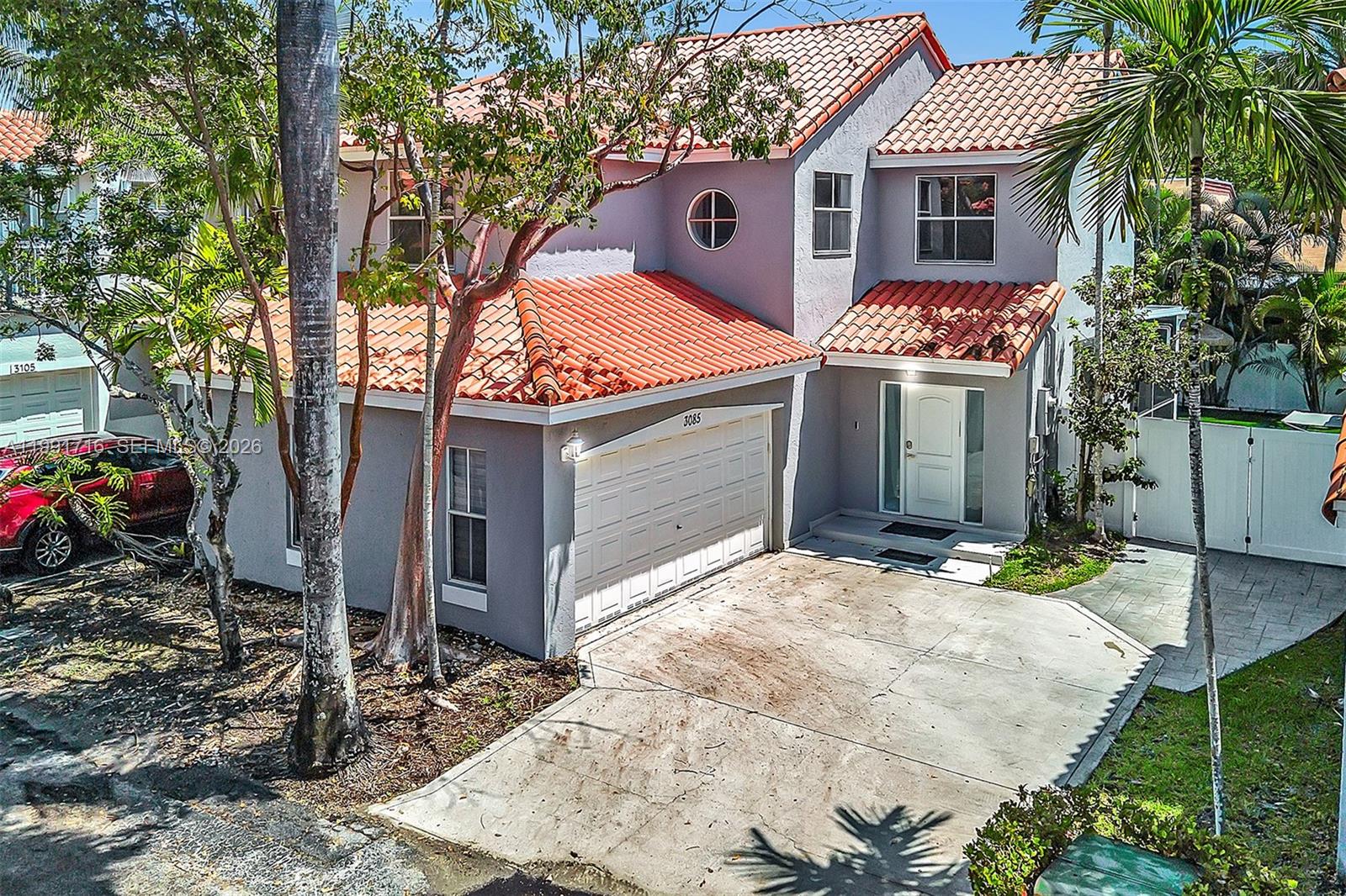 3085 North 36th Avenue Hollywood, FL 33021 - Photo 68 of 76 a view of a house with a yard and garage