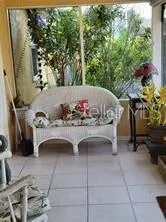 a view of balcony with furniture