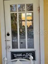 view of a bathroom with a glass door and a shower