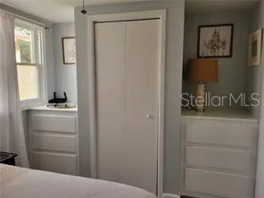 a room with a door and a cabinet