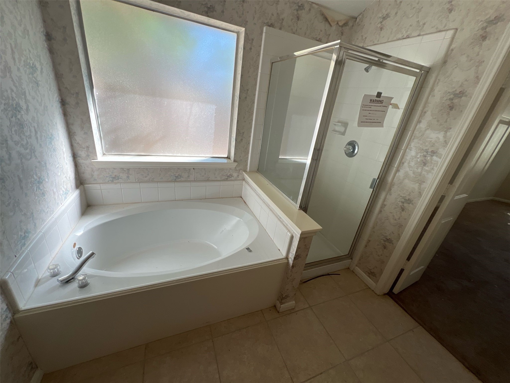 17111 Valley Palms Drive Spring, TX 77379 - Photo 16 of 29 a bath tub sitting next to a small window