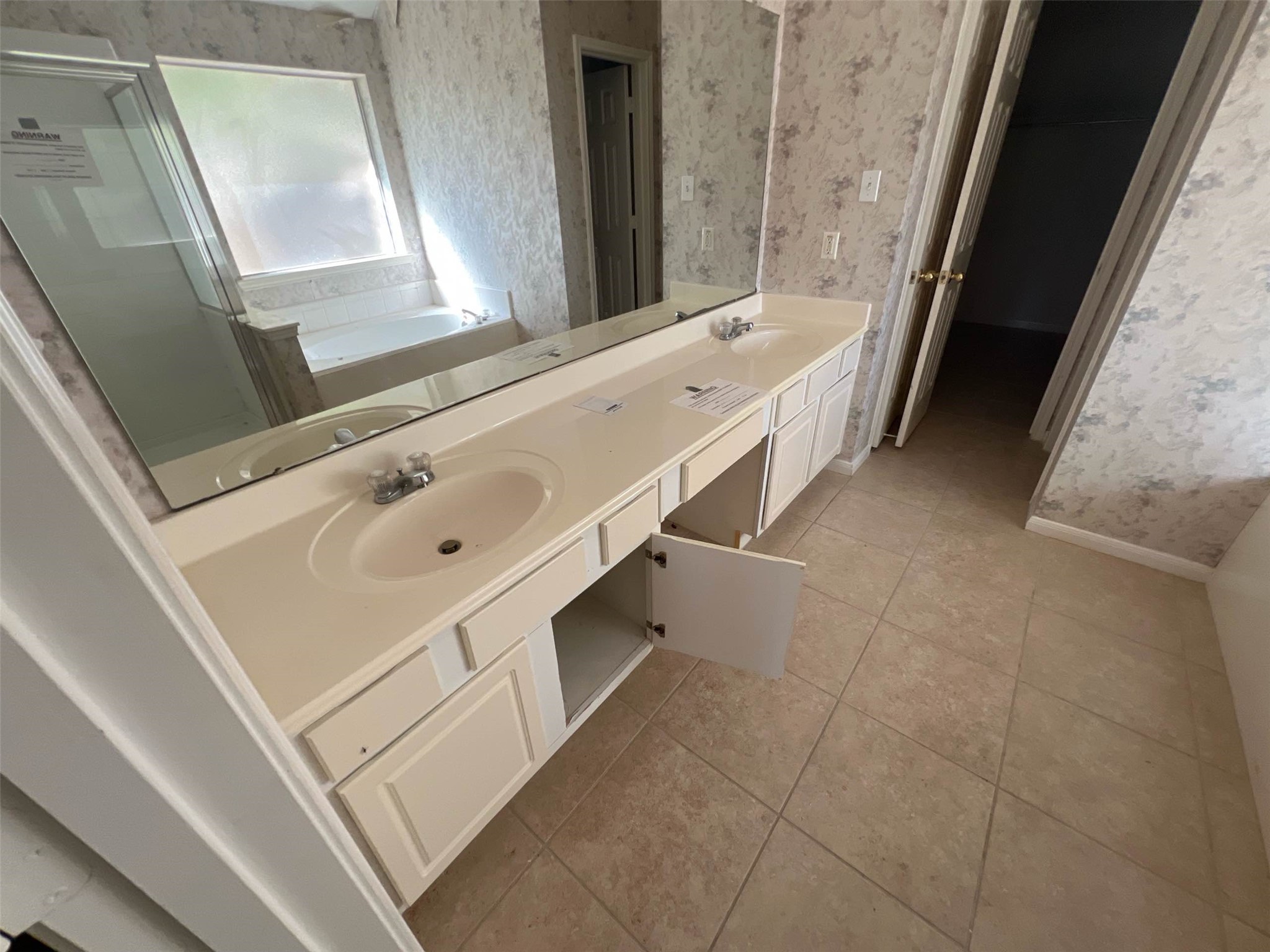 17111 Valley Palms Drive Spring, TX 77379 - Photo 18 of 29 a bathroom with a double vanity sink and a mirror