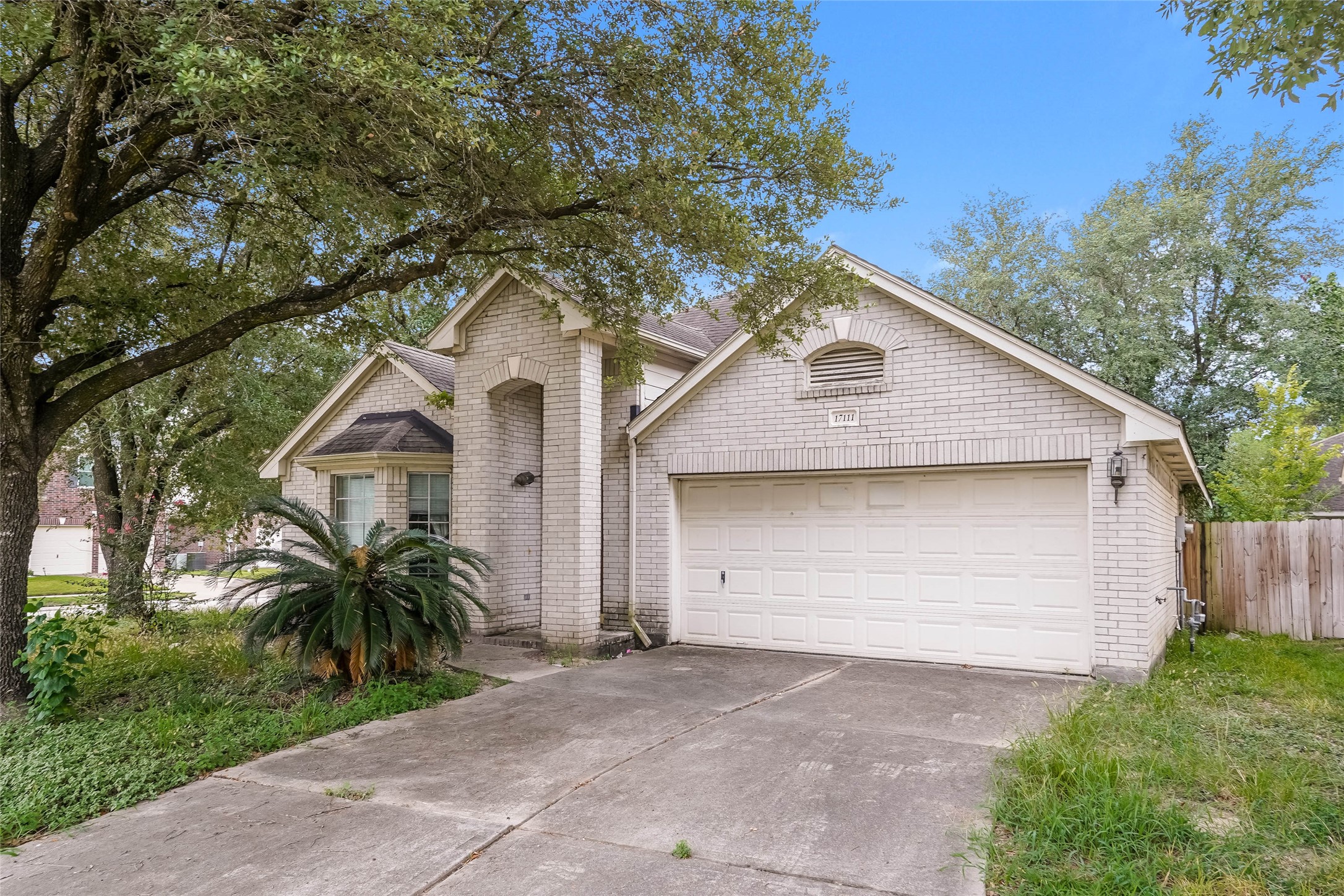 17111 Valley Palms Drive Spring, TX 77379 - Photo 2 of 29 a front view of house with yard and trees around