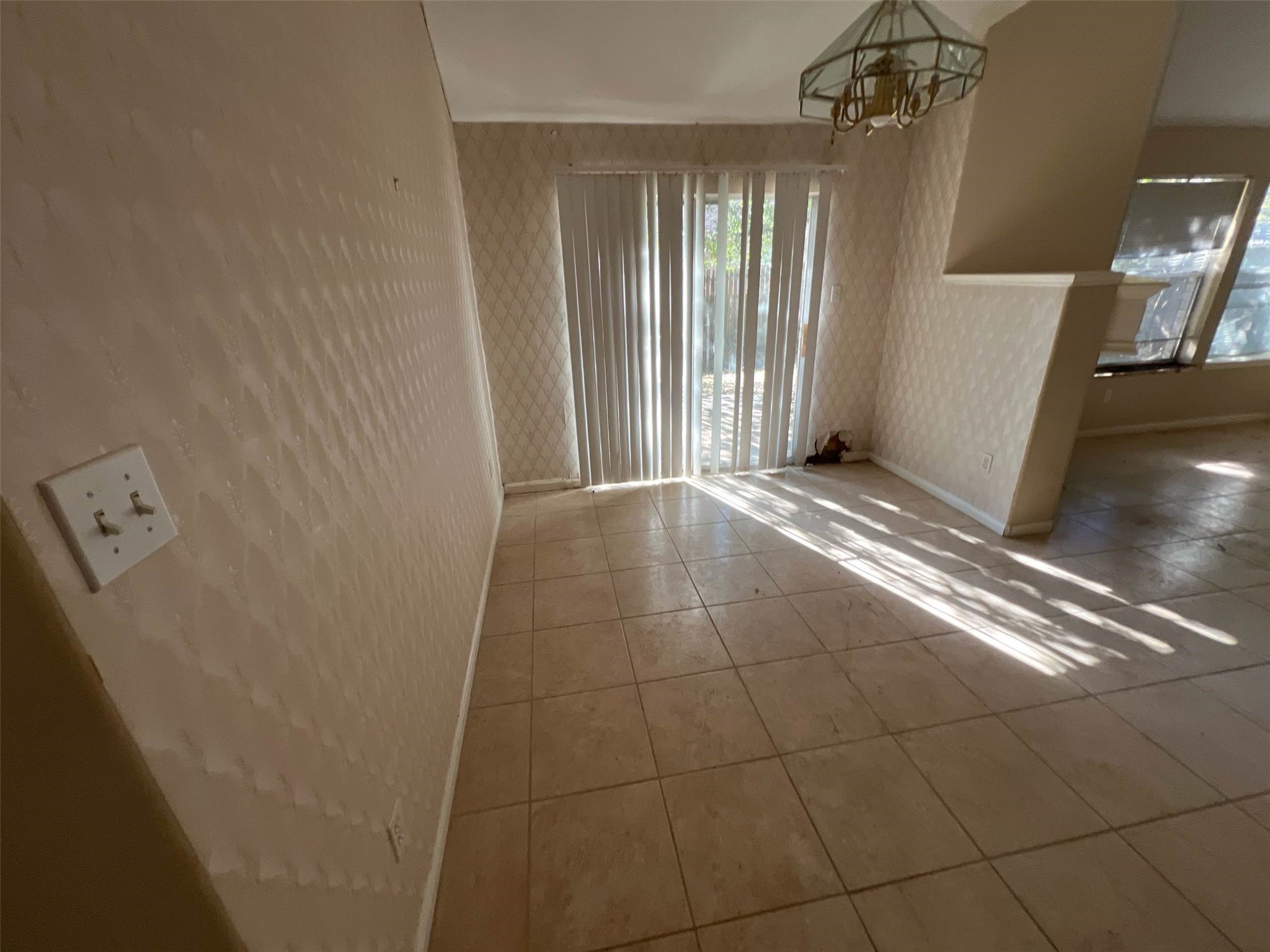 17111 Valley Palms Drive Spring, TX 77379 - Photo 22 of 29 a view of an empty room with wooden floor and a window