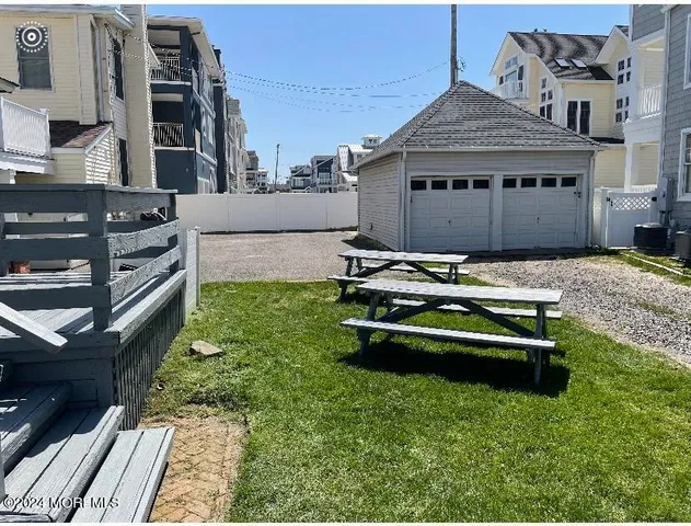 a backyard of a house with barbeque oven