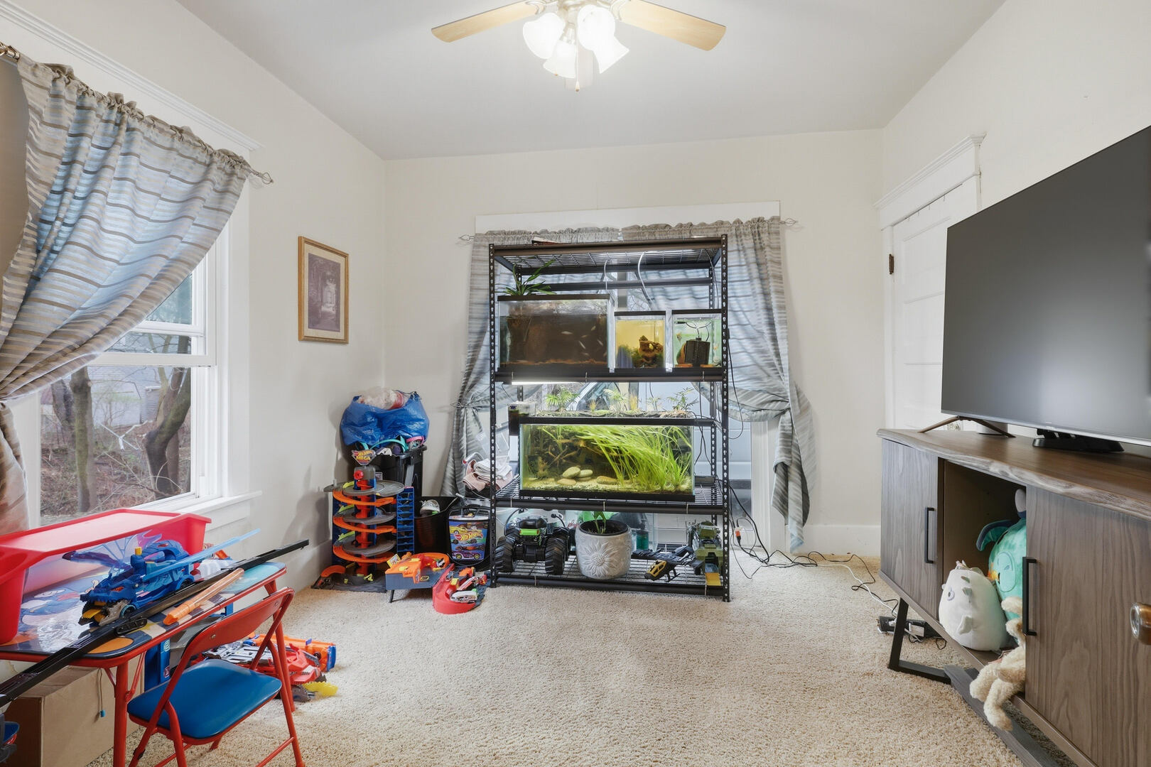 2224 41st Street Rock Island, IL 61201 - Photo 15 of 25 a children room with toys and a flat screen tv