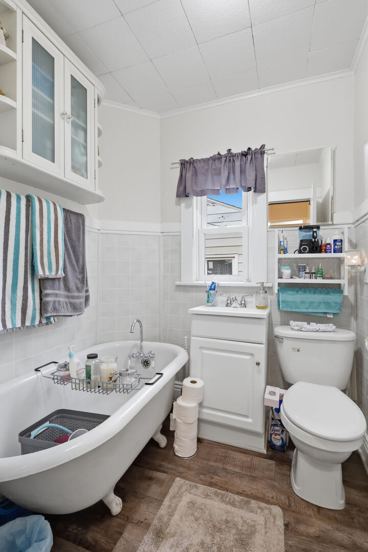 2224 41st Street Rock Island, IL 61201 - Photo 16 of 25 a bathroom with a toilet a sink and a bathtub