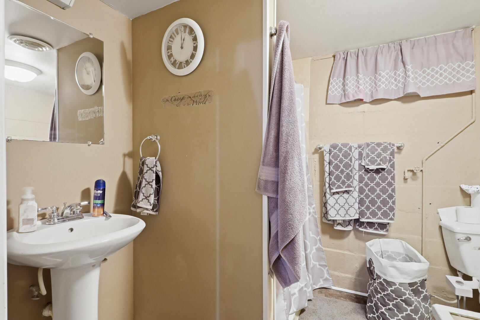 2224 41st Street Rock Island, IL 61201 - Photo 18 of 25 a bathroom with a sink a toilet and a shower