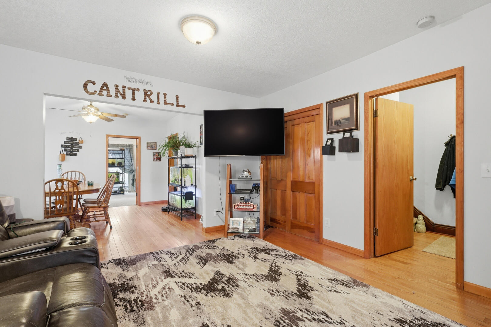 2224 41st Street Rock Island, IL 61201 - Photo 3 of 25 a living room with furniture and a flat screen tv