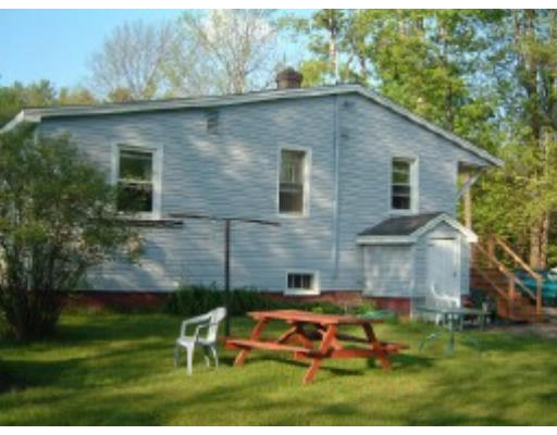 167 State Road Templeton, MA 01436 - Photo 3 of 7 a backyard of a house with table and chairs