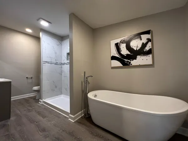 a white bath tub sitting in a bathroom