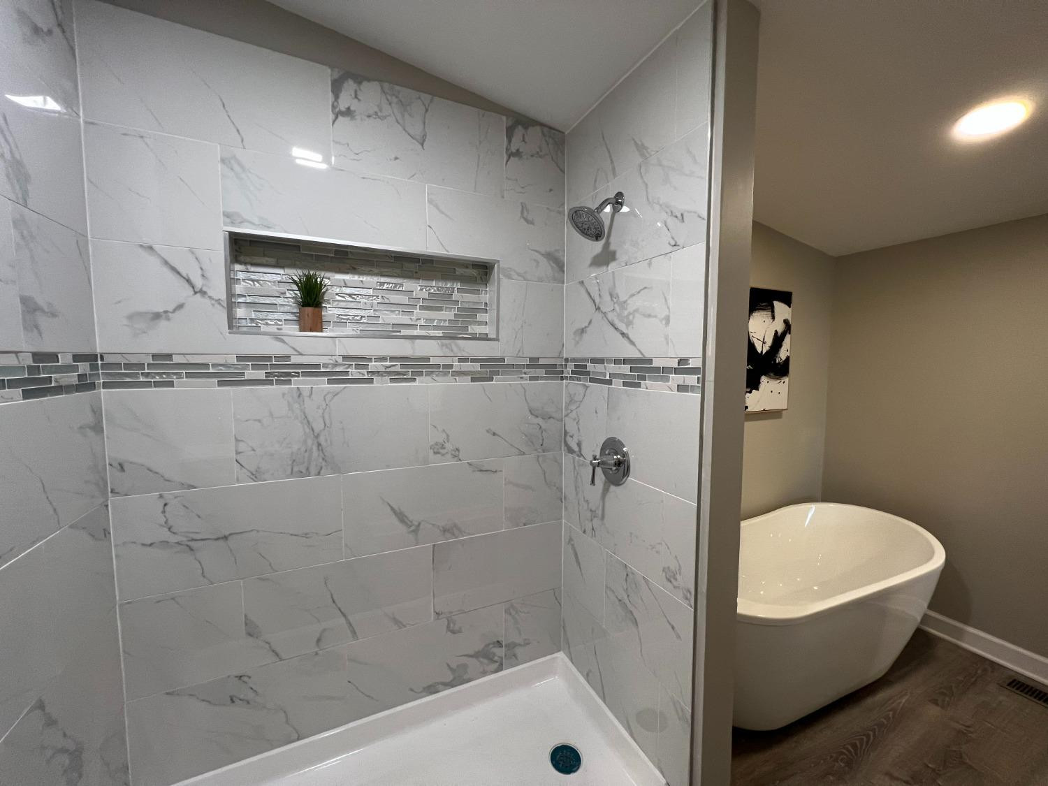 276 North Henry Street Gary, IN 46403 - Photo 18 of 34 a bathroom with a bathtub and a shower