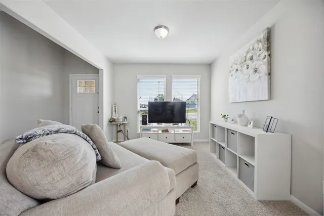 a living room with furniture and window