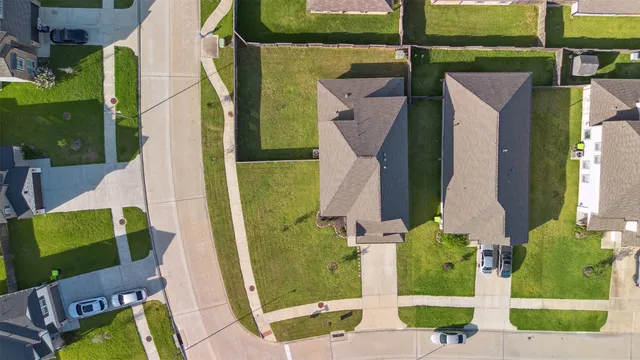 an aerial view of a house with a garden