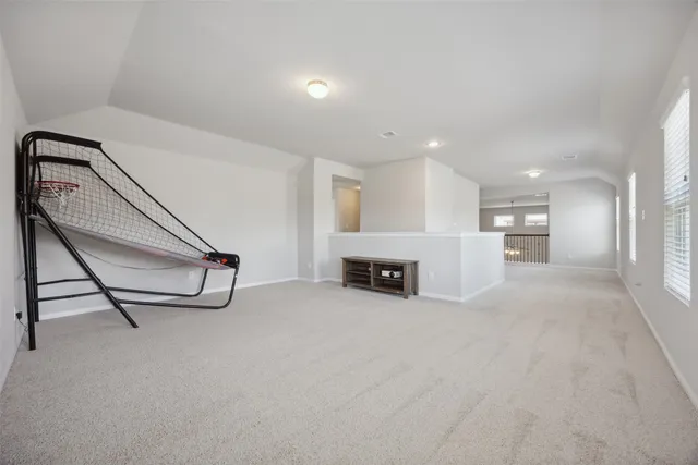a view of a livingroom with a furniture and a ceiling fan