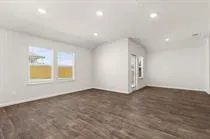a view of a kitchen with a sink and a window