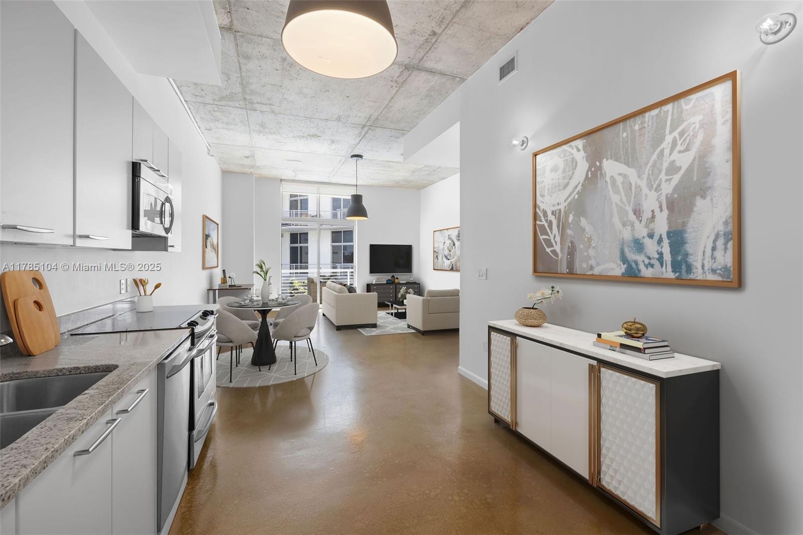 2001 Meridian Avenue, Unit 412 Miami Beach, FL 33139 - Photo 3 of 31 a living room with furniture kitchen view and a window