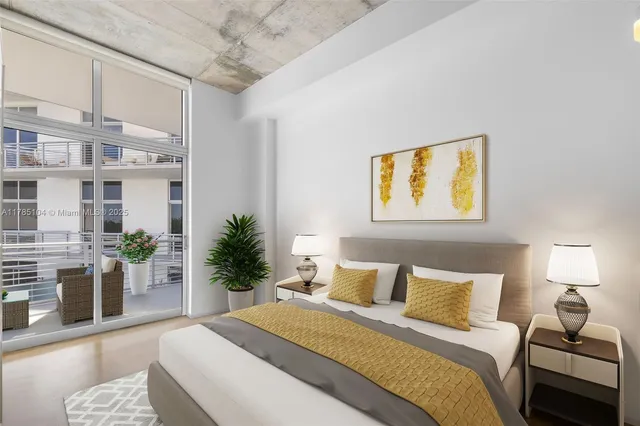 a bedroom with a bed painting on wall and a potted plant