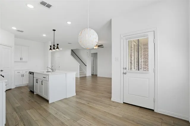 a view of a kitchen with electric appliances