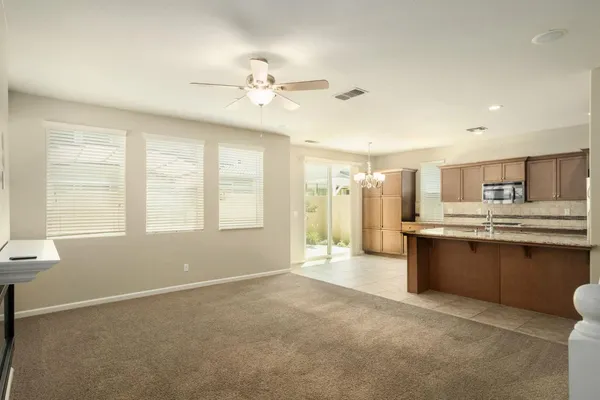 a kitchen with stainless steel appliances granite countertop a sink and cabinets