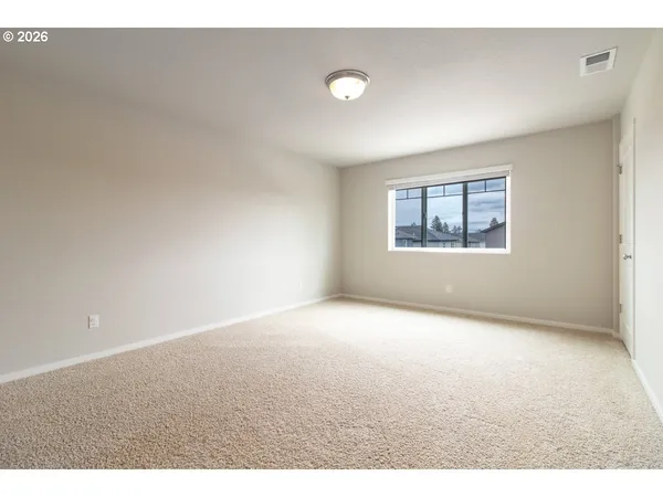a view of empty room with windows