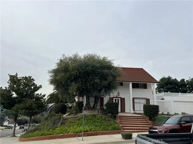 a front view of a house with garage