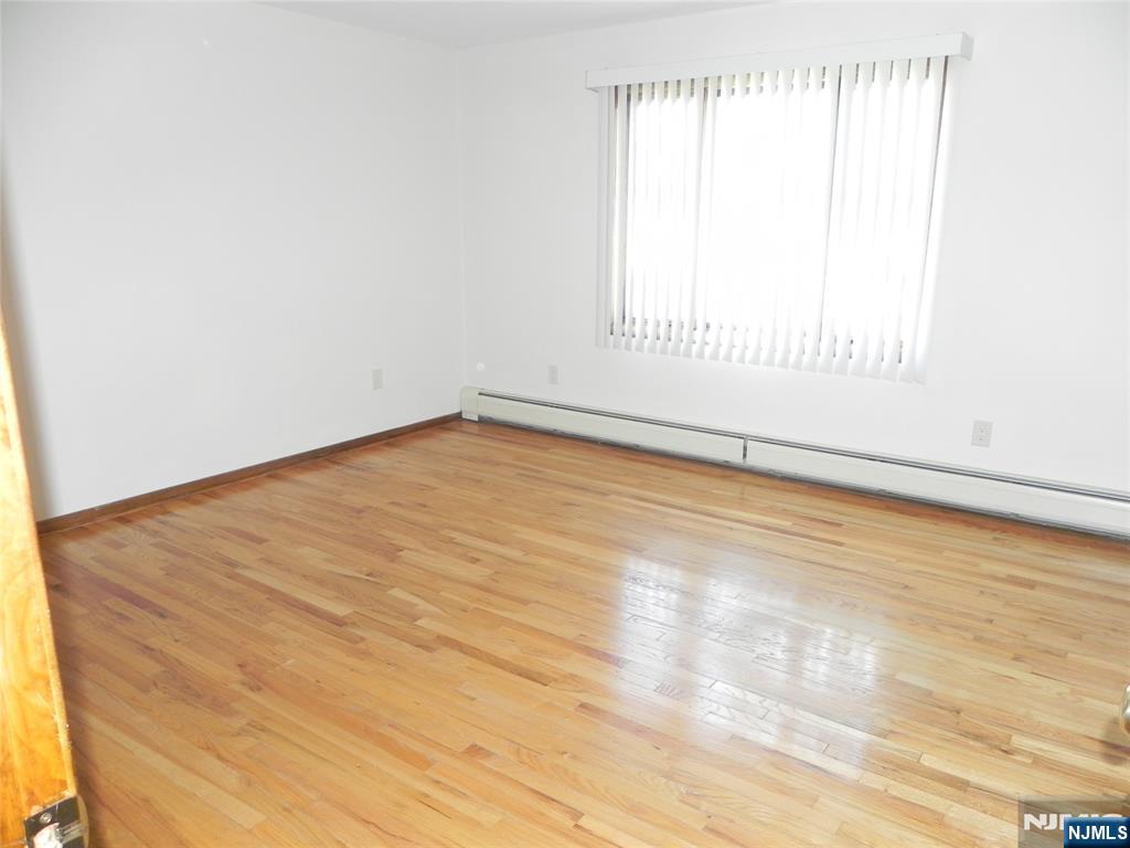 52 Wilson Street, Unit 2 Little Ferry, NJ 07643 - Photo 7 of 11 an empty room with a window