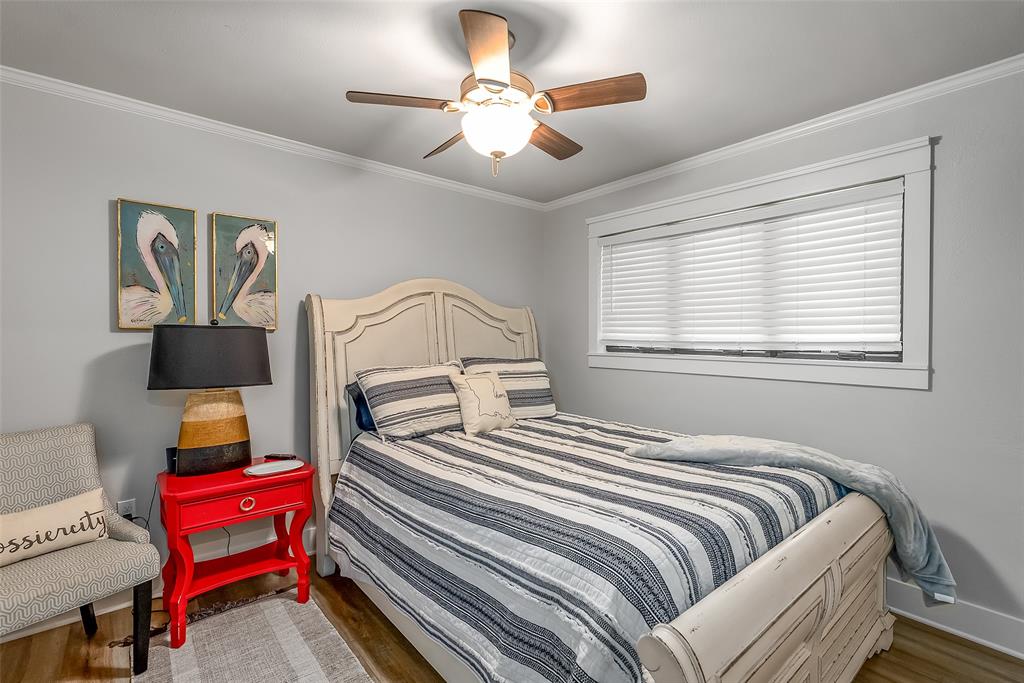 128 Knott Drive Many, LA 71449 - Photo 21 of 39 a bedroom with bed and a chandelier