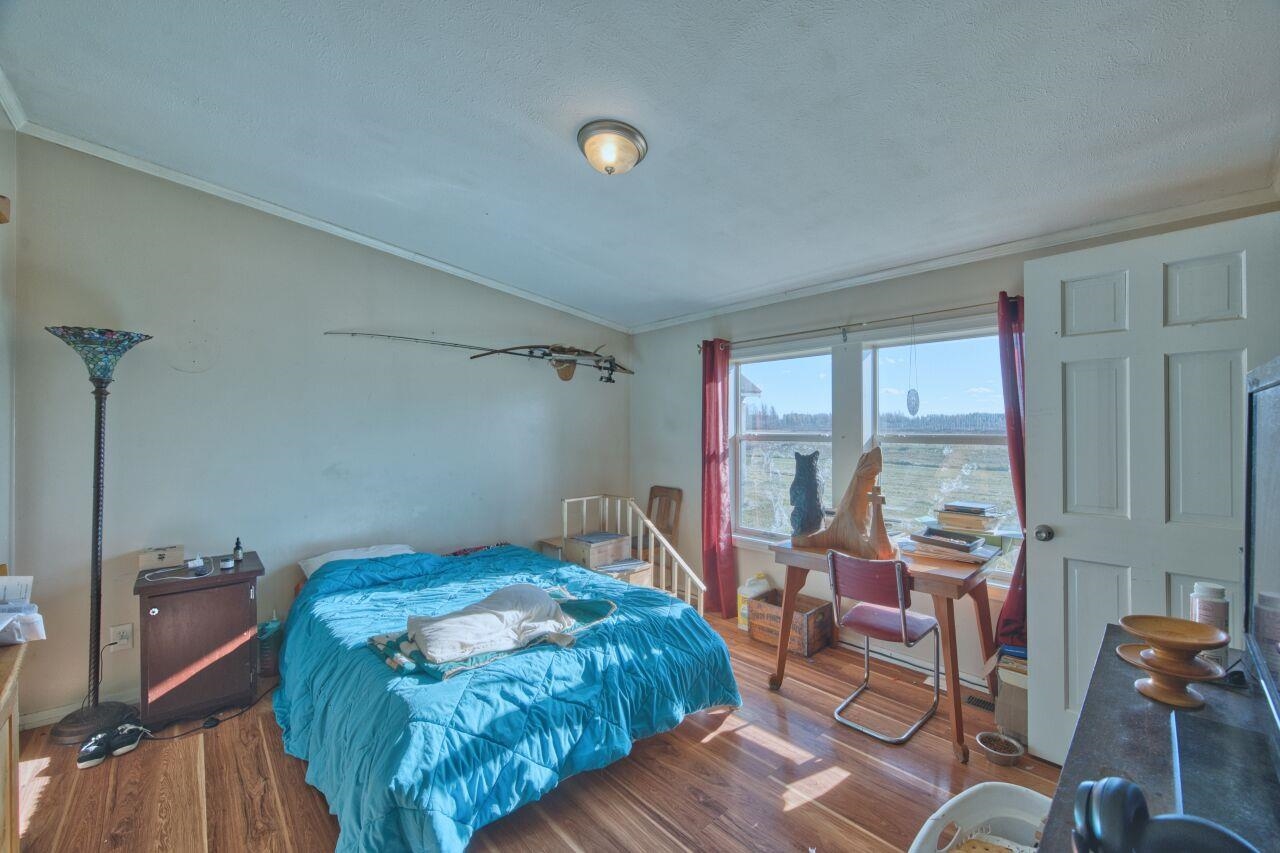 3932 Hwy 100 Aurora Mn 55705 Aurora, MN 55705 - Photo 15 of 44 Bedroom with wood finished floors, ornamental molding, and vaulted ceiling