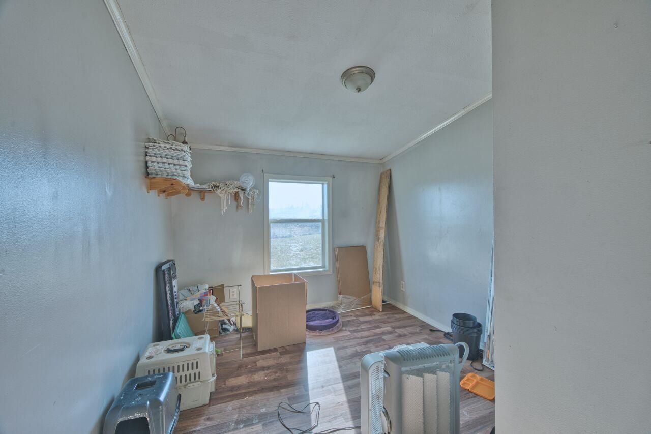 3932 Hwy 100 Aurora Mn 55705 Aurora, MN 55705 - Photo 16 of 44 Interior space featuring ornamental molding and wood finished floors