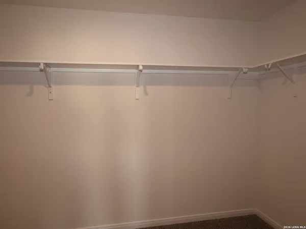 a view of a room with racks on the wall