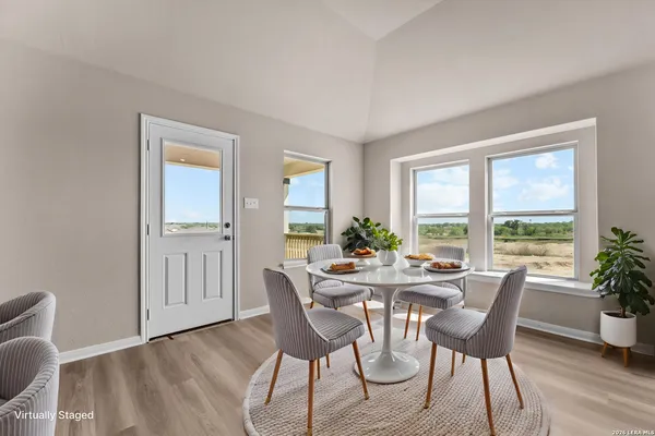 a view of a dining room with furniture window and outside view