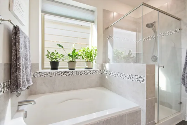 a white bath tub sitting in front of a bathroom