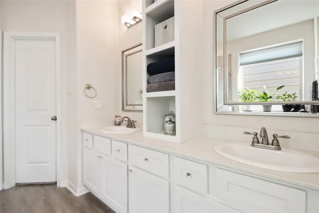 a bathroom with a sink and a window