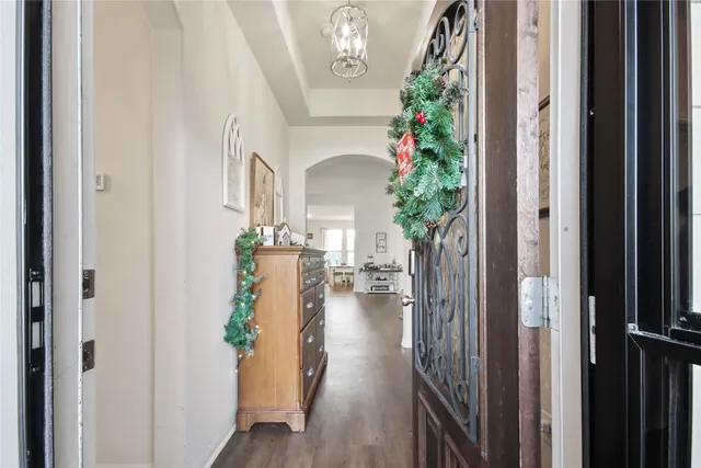 a view of entryway with livingroom and wooden floor