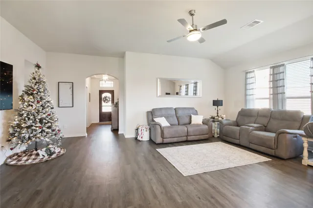 a living room with furniture and a large window