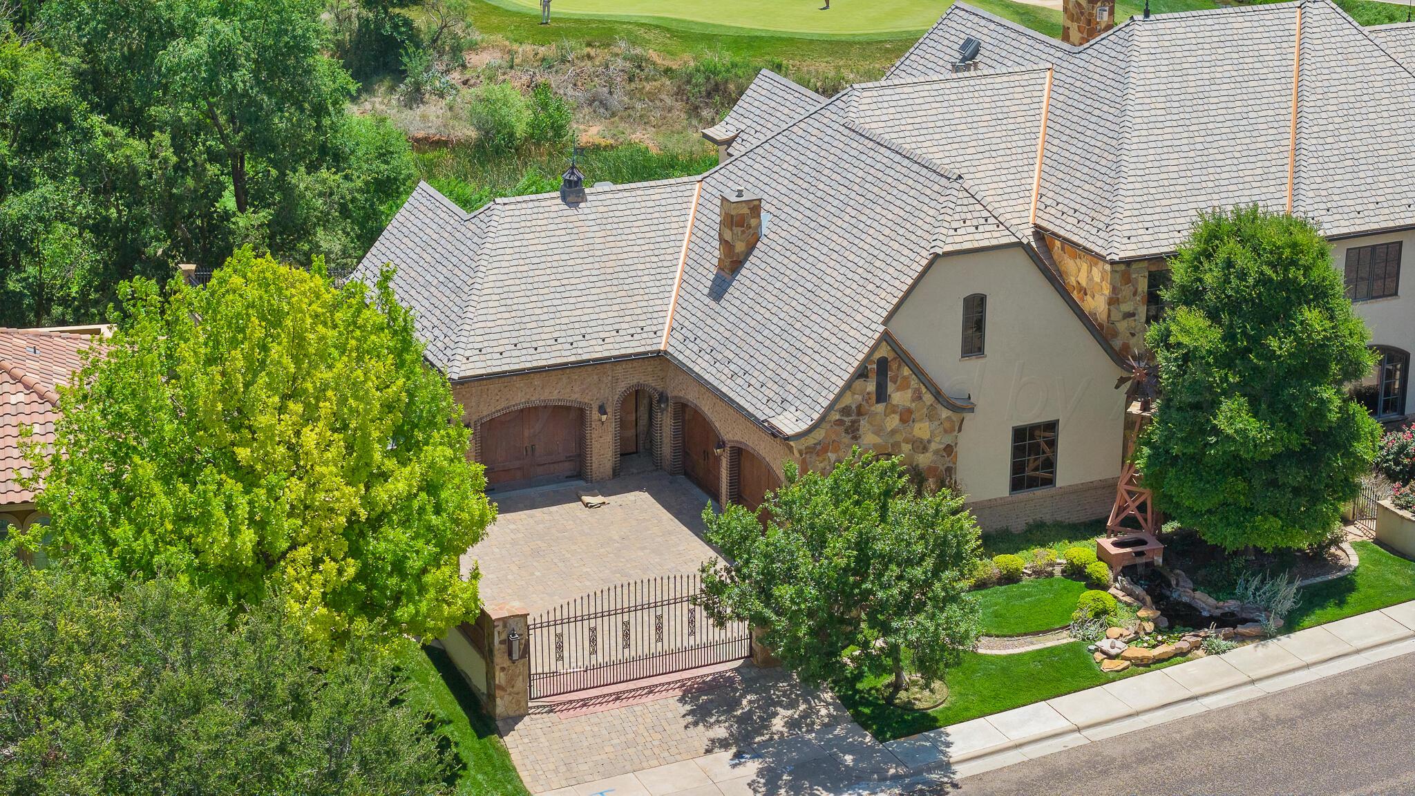 18 Cypress Point Amarillo, TX 79124 - Photo 92 of 95 a aerial view of a house with a yard and potted plants