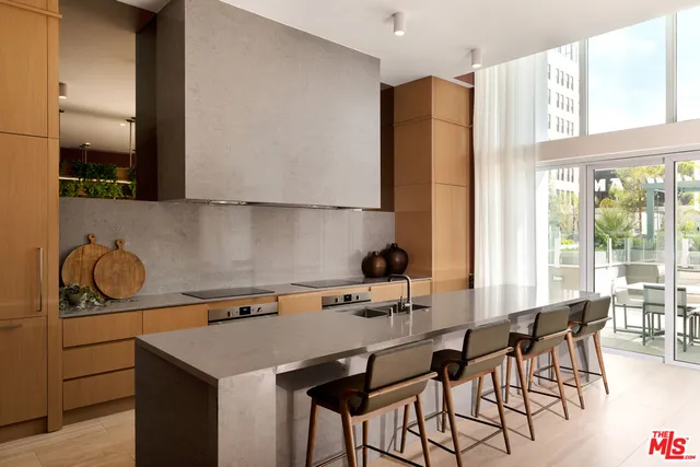 a kitchen with a sink a stove and a refrigerator