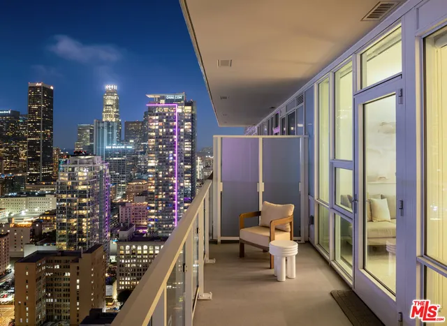 a view of a building with traffic signal lights