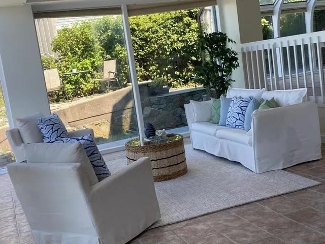 a view of sitting area with furniture and a yard