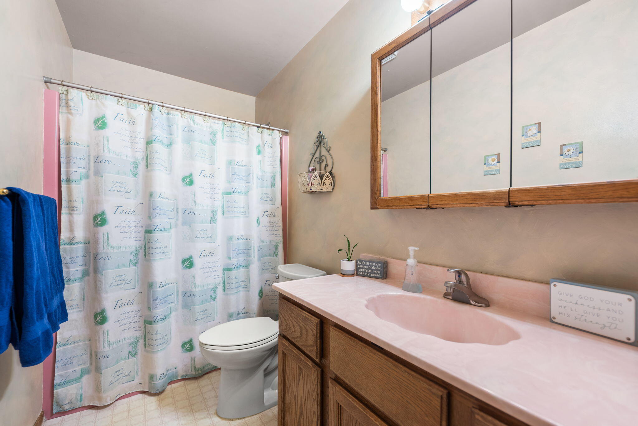 902 Aspen Street Hebron, IN 46341 - Photo 11 of 20 a bathroom with a granite countertop sink a toilet and shower