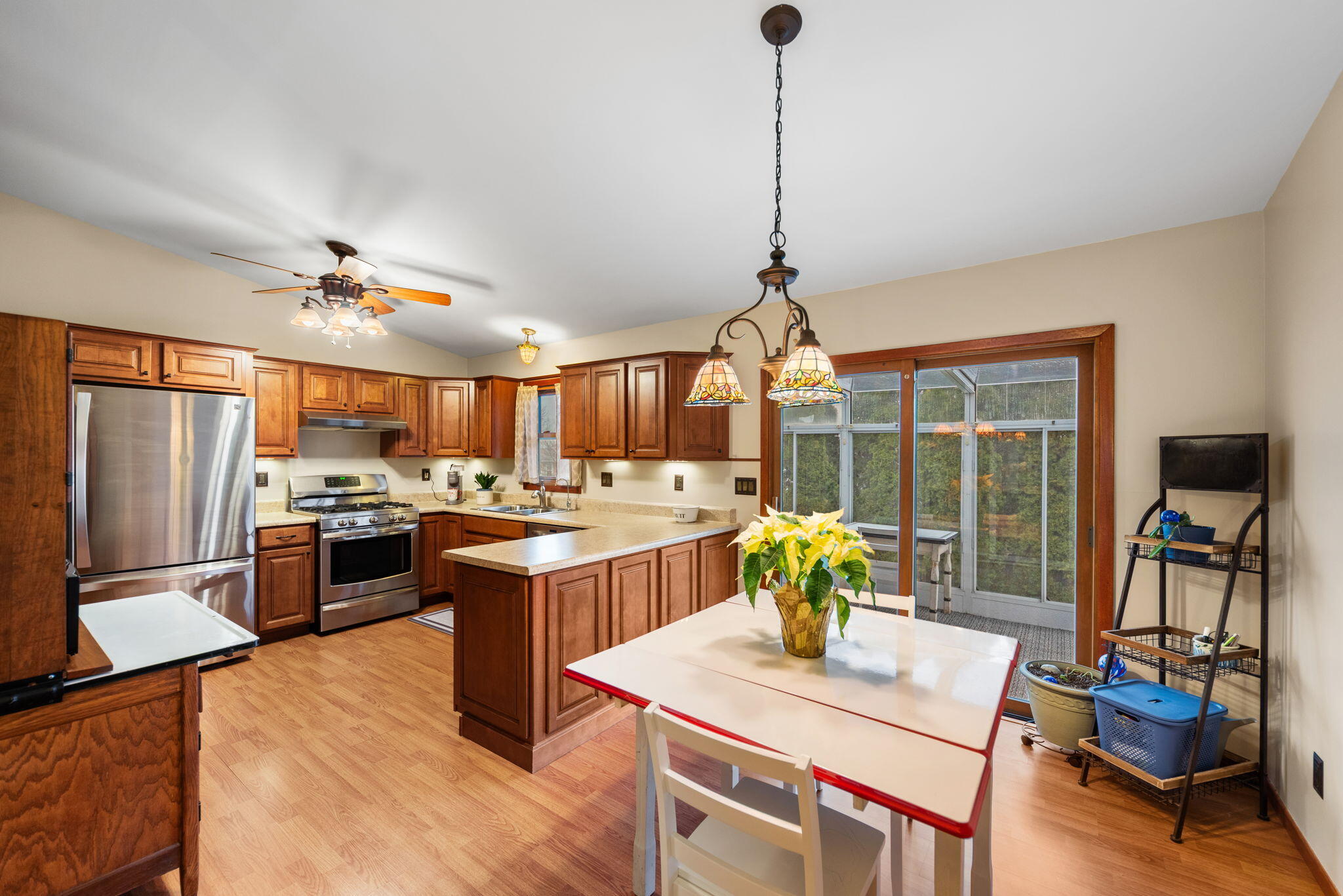902 Aspen Street Hebron, IN 46341 - Photo 7 of 20 a view of a kitchen with furniture and a chandelier