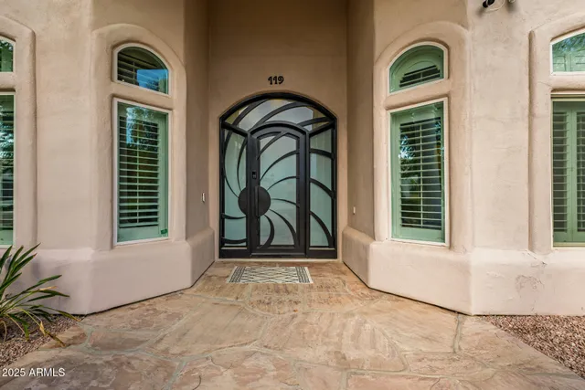 a view of a kitchen with a sink and a refrigerator