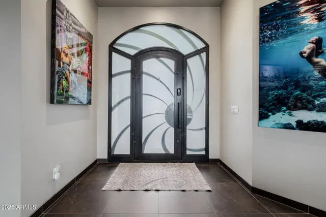 a bathroom with a toilet and a mirror