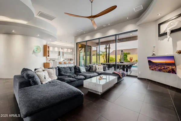 a living room with furniture and a large window