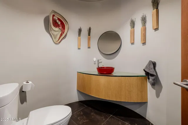 a living room with a pool table and windows