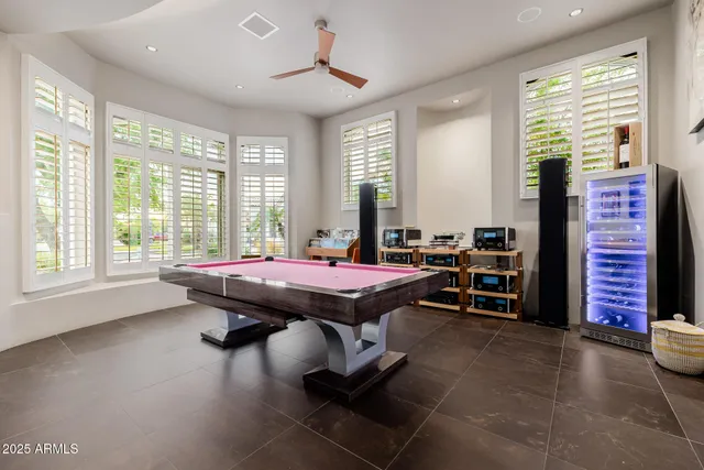 an aerial view of residential houses with outdoor space and trees